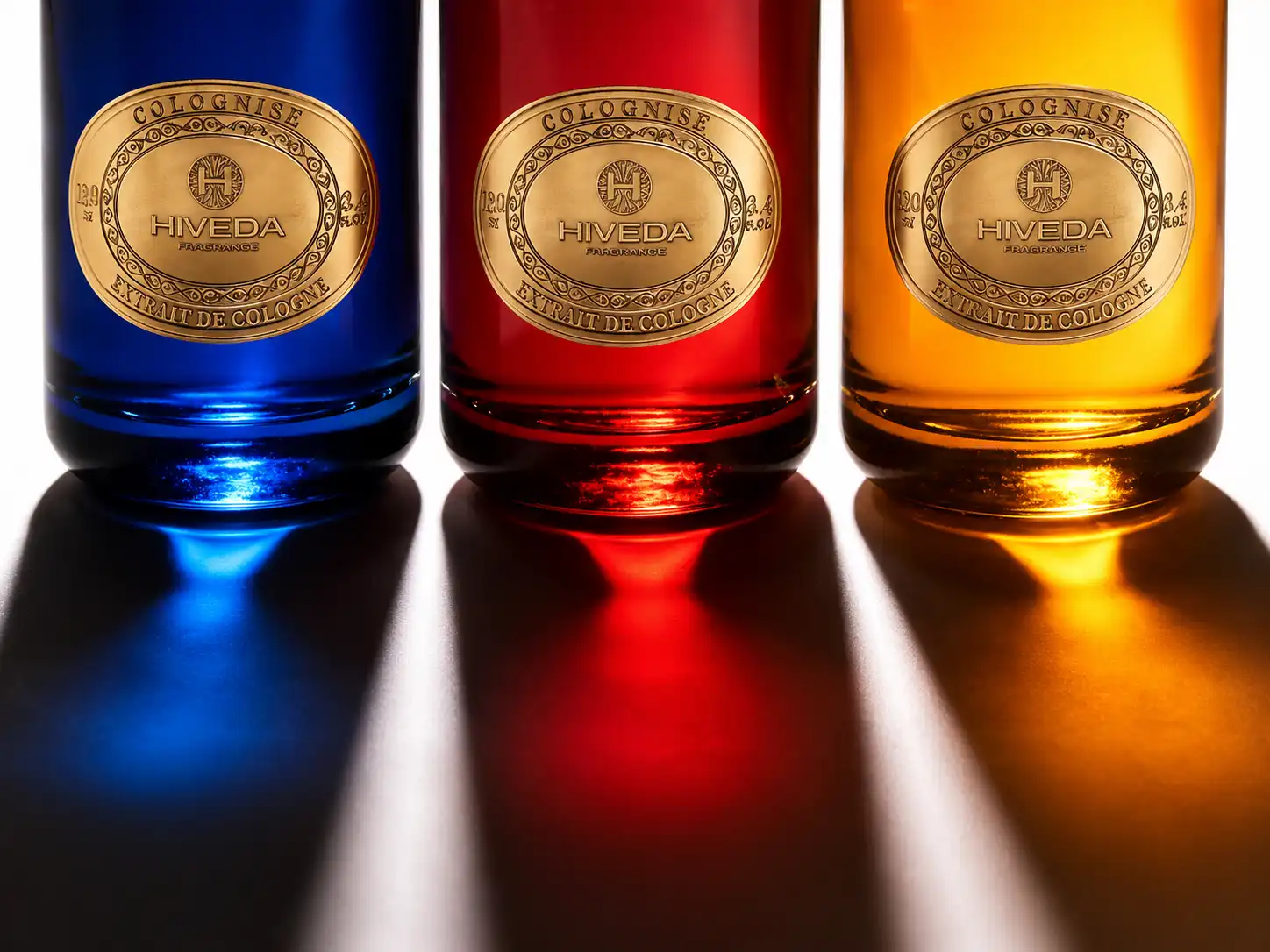 perfume bottles in blue burgundy and amber color directions