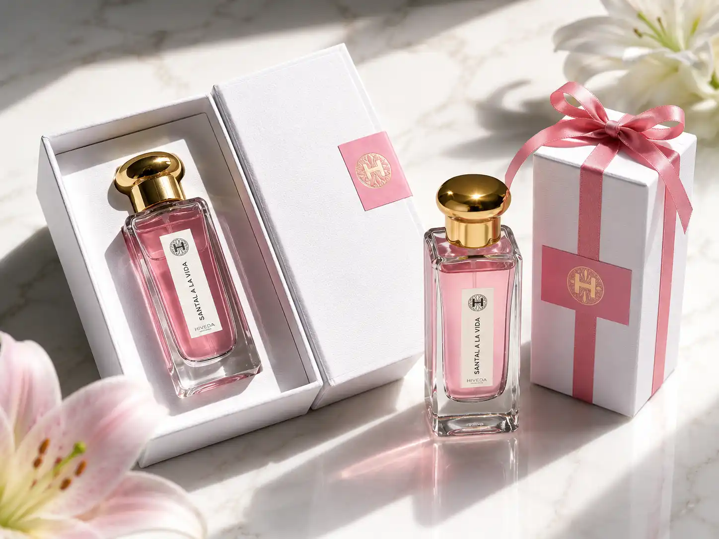 pink perfume bottle with white presentation box and ribbon