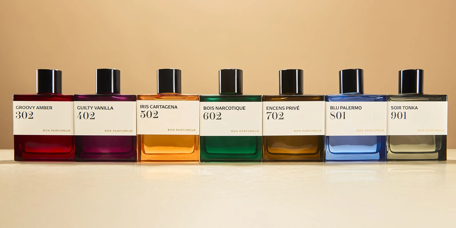 Row of Bon Parfumeur perfume bottles with different numbered coloured labels