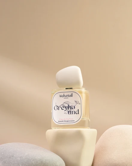 Velvétail Greyhound perfume bottle with illustrated front label and rounded white upper element