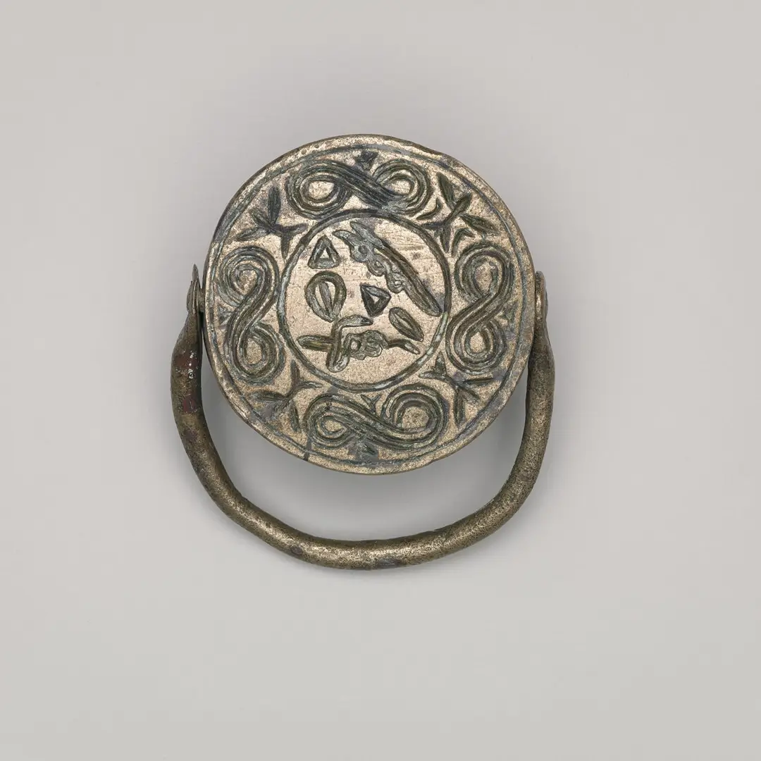 Hittite stamp seal with circular motifs, eagle and serpent imagery