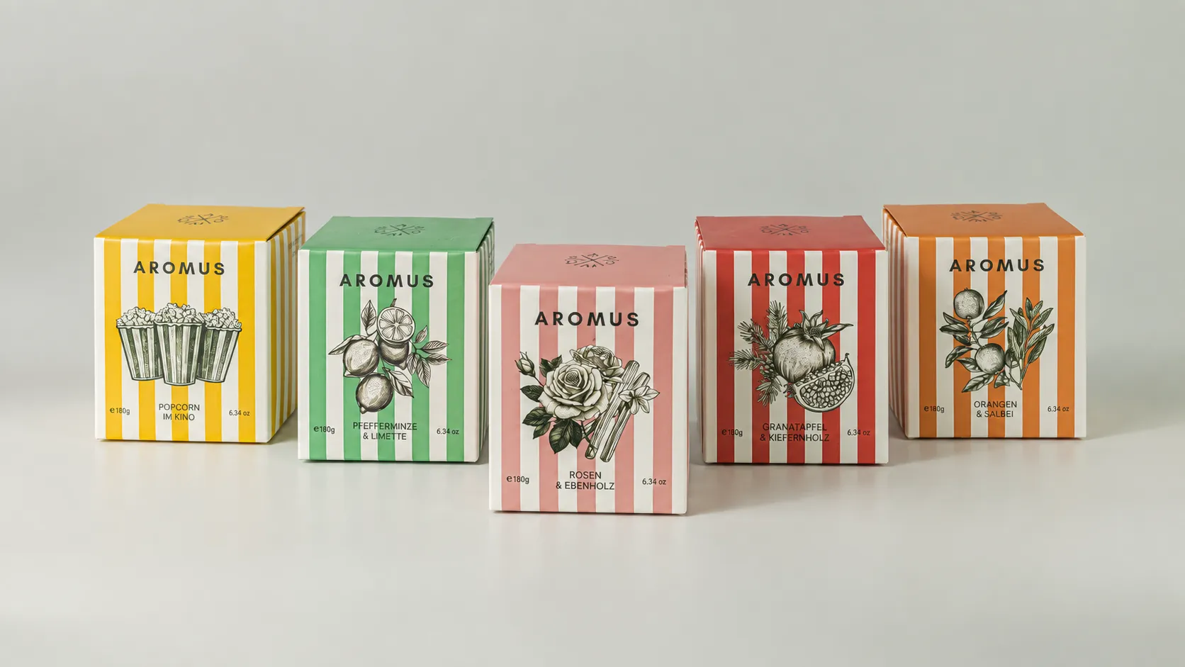 Five AROMUS candle boxes in coordinated yellow, green, pink, red and orange stripe designs