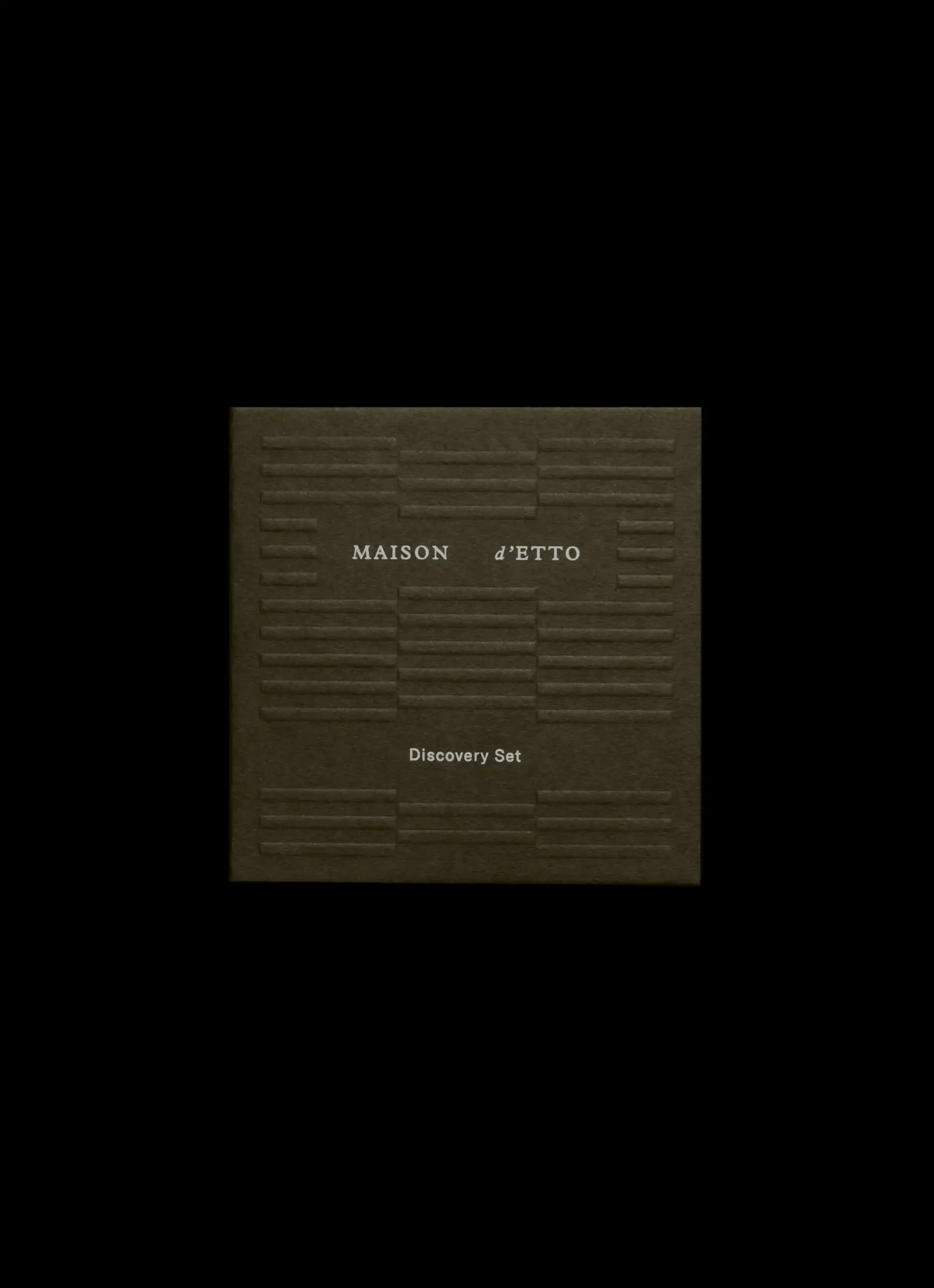 Maison d'Etto moss green packaging with blind embossed geometric pattern and white typography