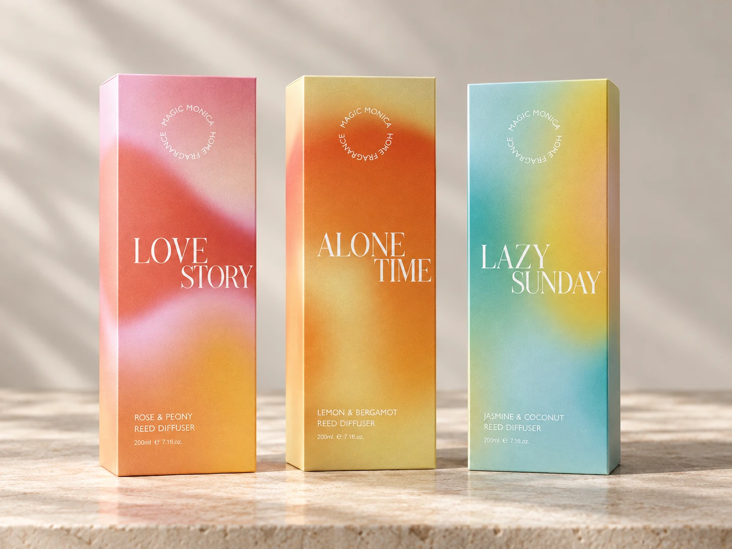 Three tall reed diffuser cartons with pink-orange, orange-yellow and blue-green gradient designs
