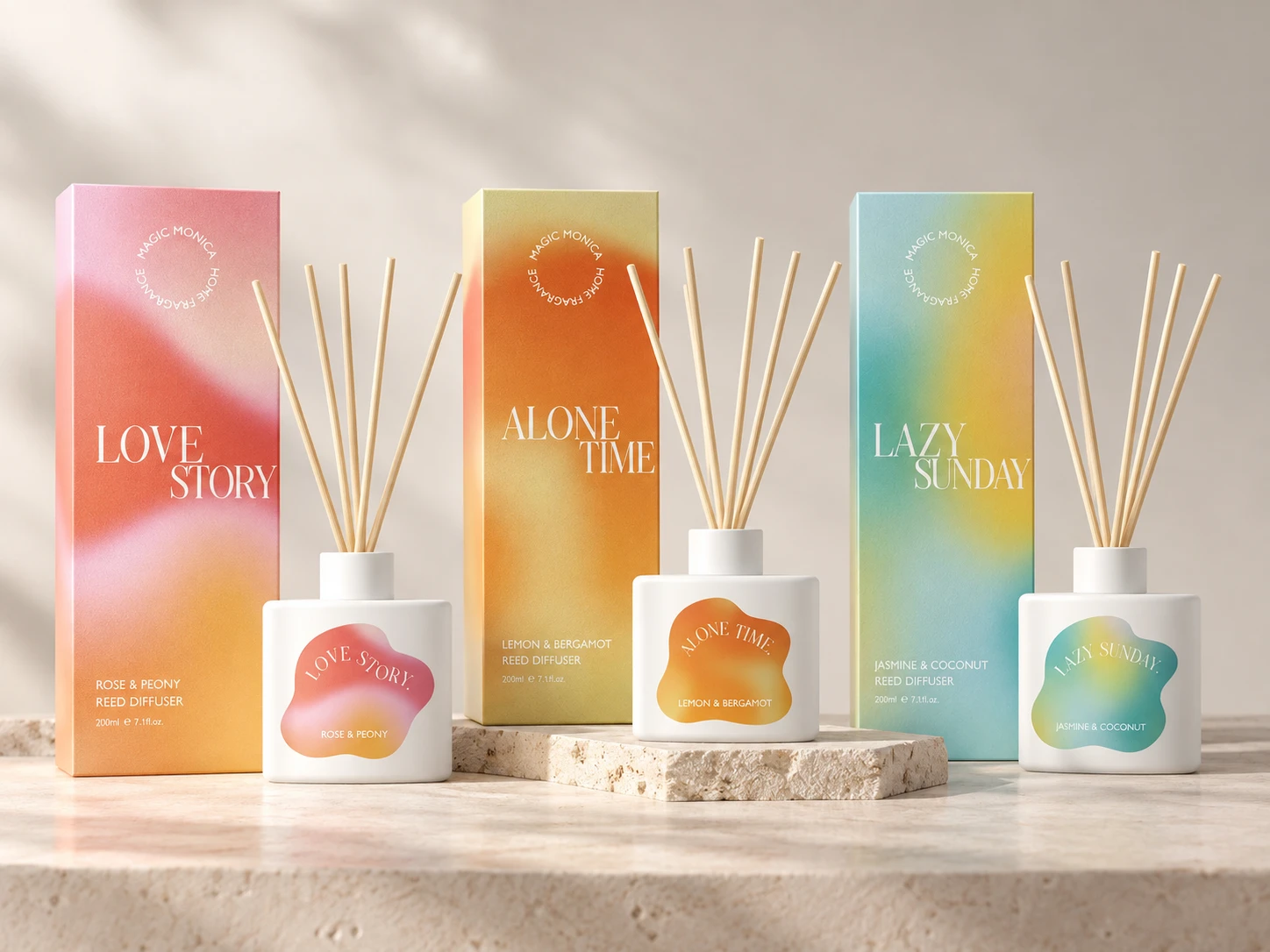 Three white reed diffuser bottles with matching gradient packaging for Love Story, Alone Time and Lazy Sunday
